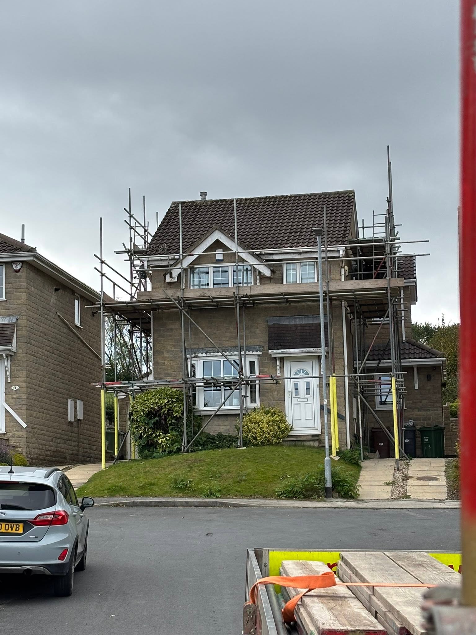 Scaffold erected around a detached house in Leeds for roof access
