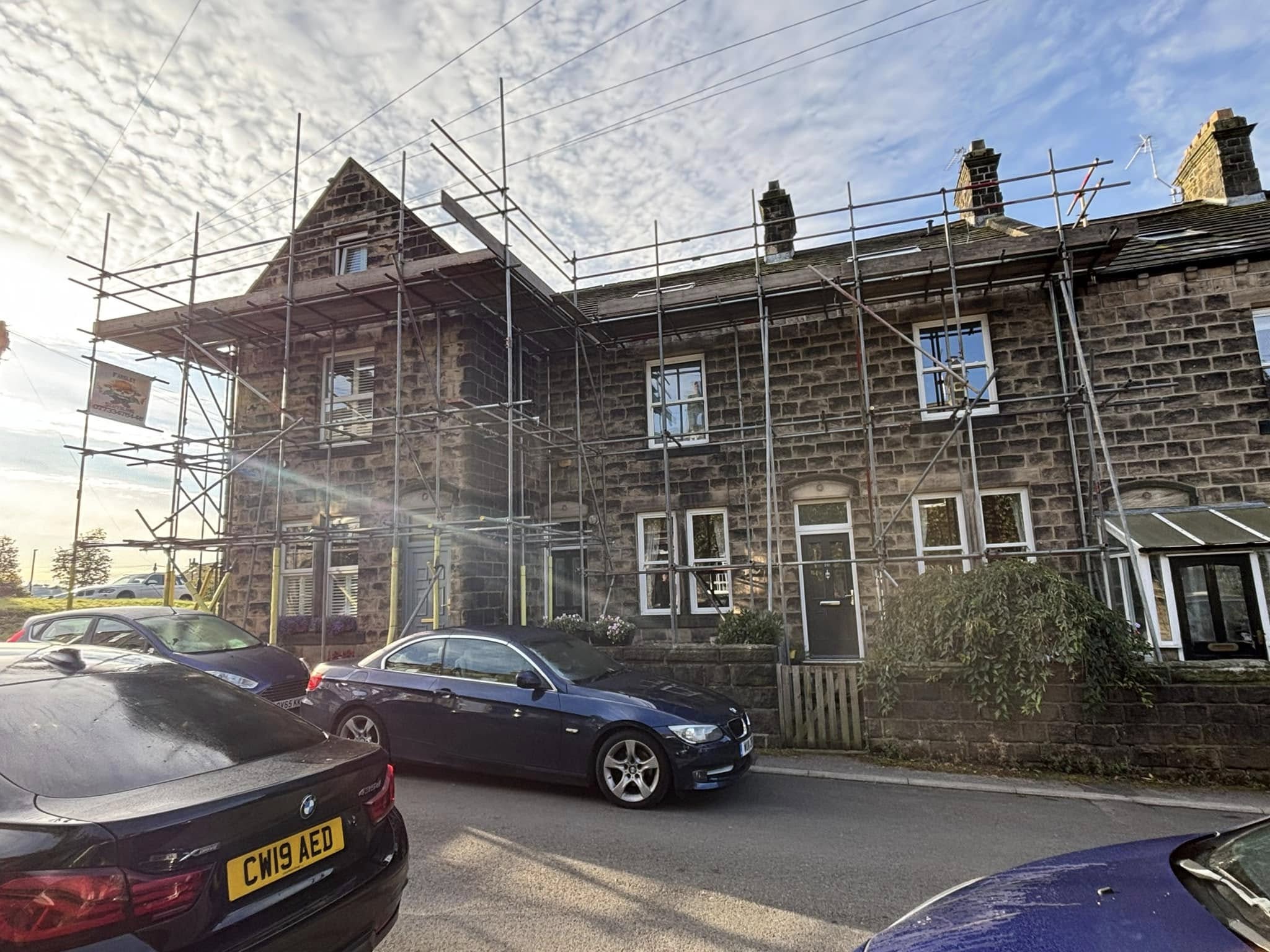 Scaffold around a stone-built house in Leeds